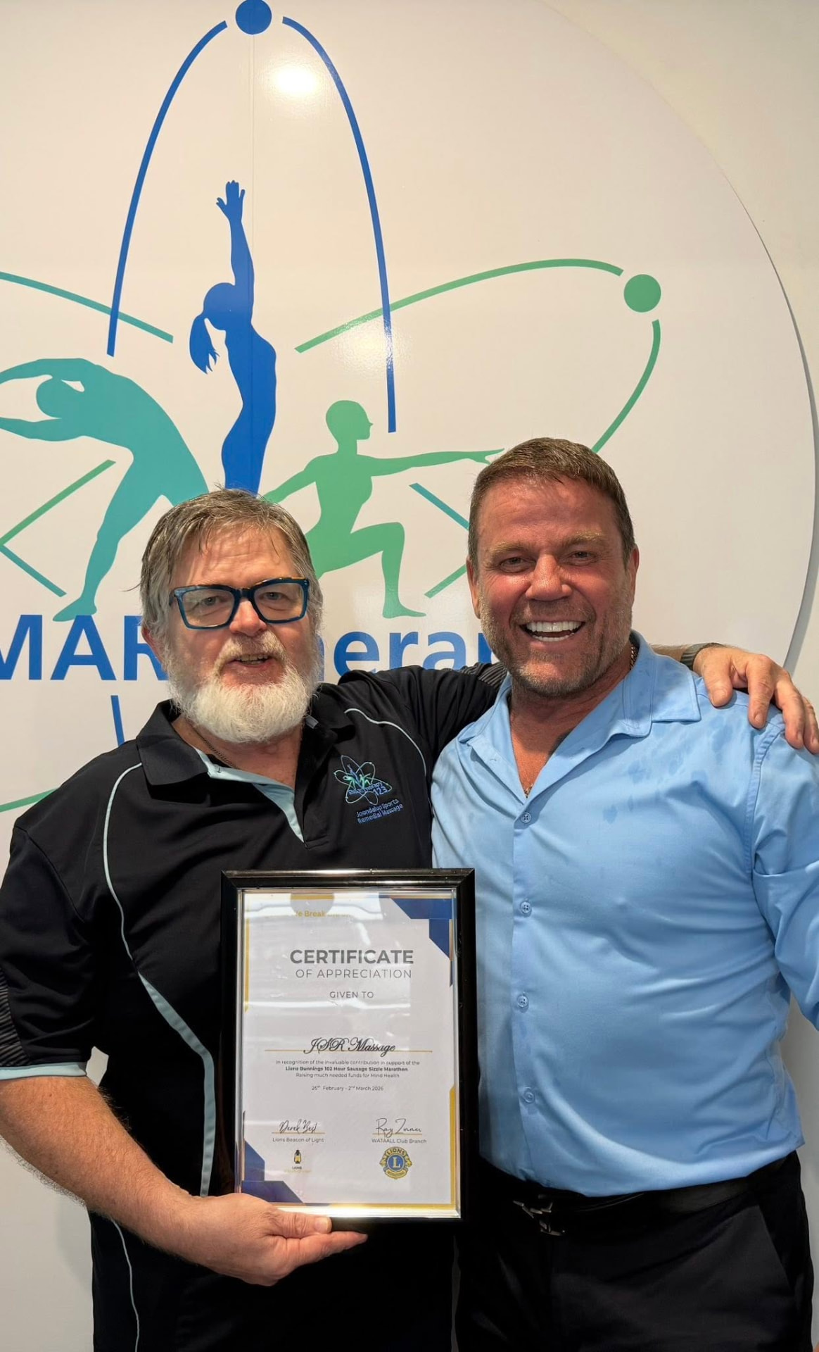 Lions members presenting a certificate of appreciation